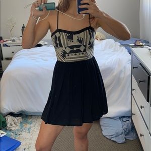 Black mini dress with crotchet like design on top